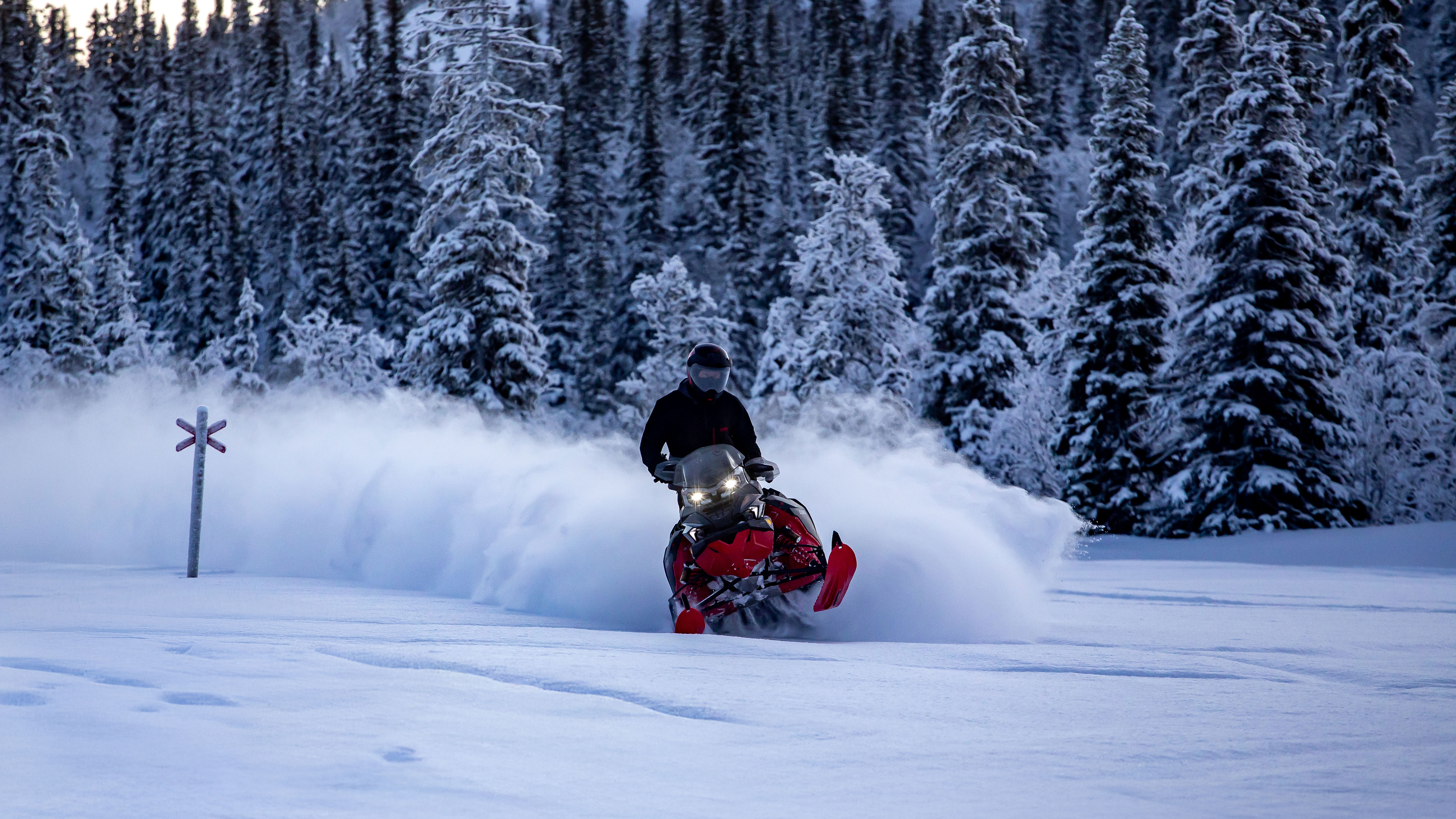 2026 Lynx Brutal RE 850 E-TEC wide-track snowmobile carving on snowy trail