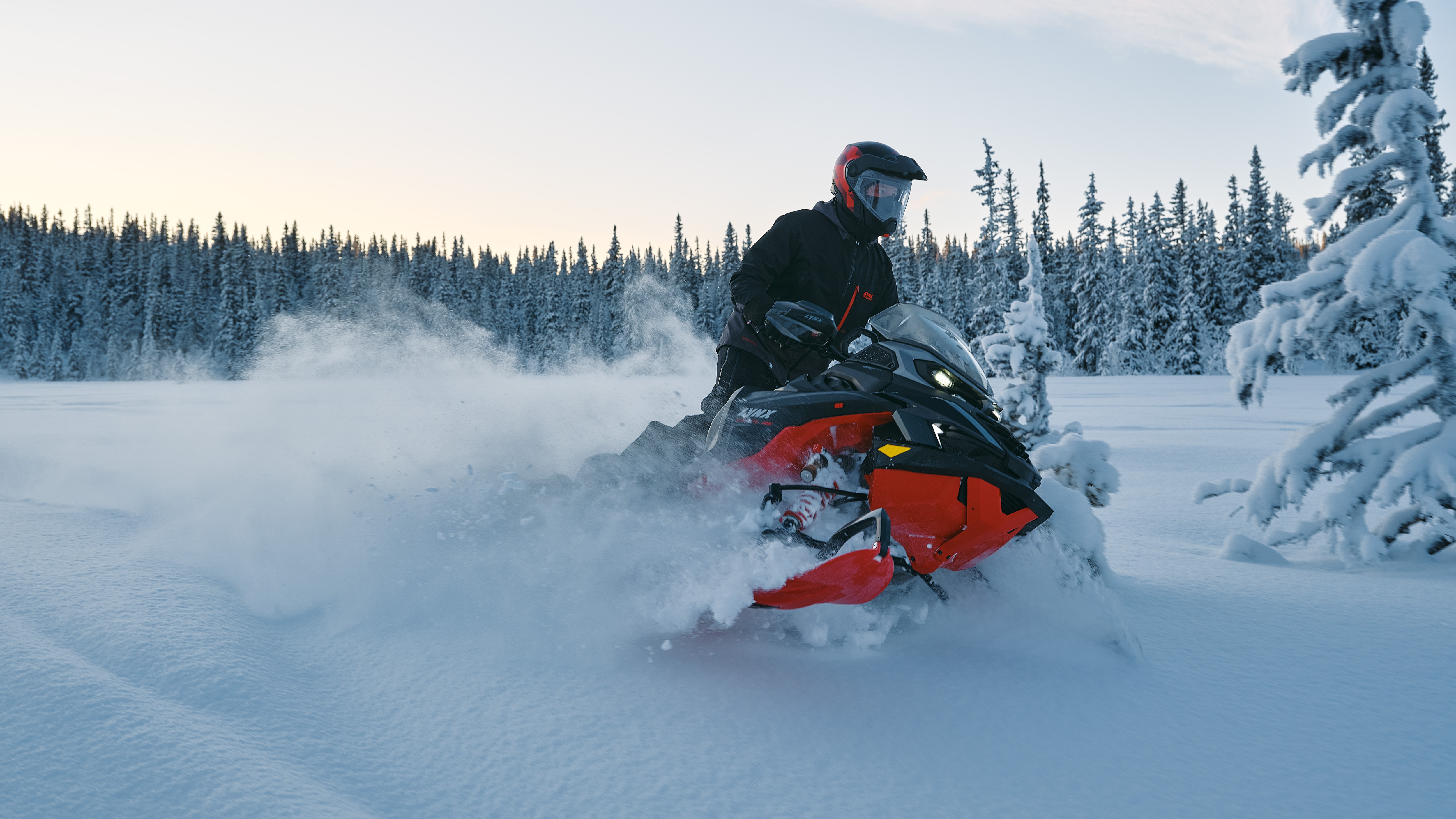 2026 Lynx Brutal RE 850 E-TEC wide-track snowmobile carving in powder snow