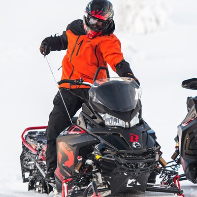 Rider pulling the SHOT Starter of his snowmobile