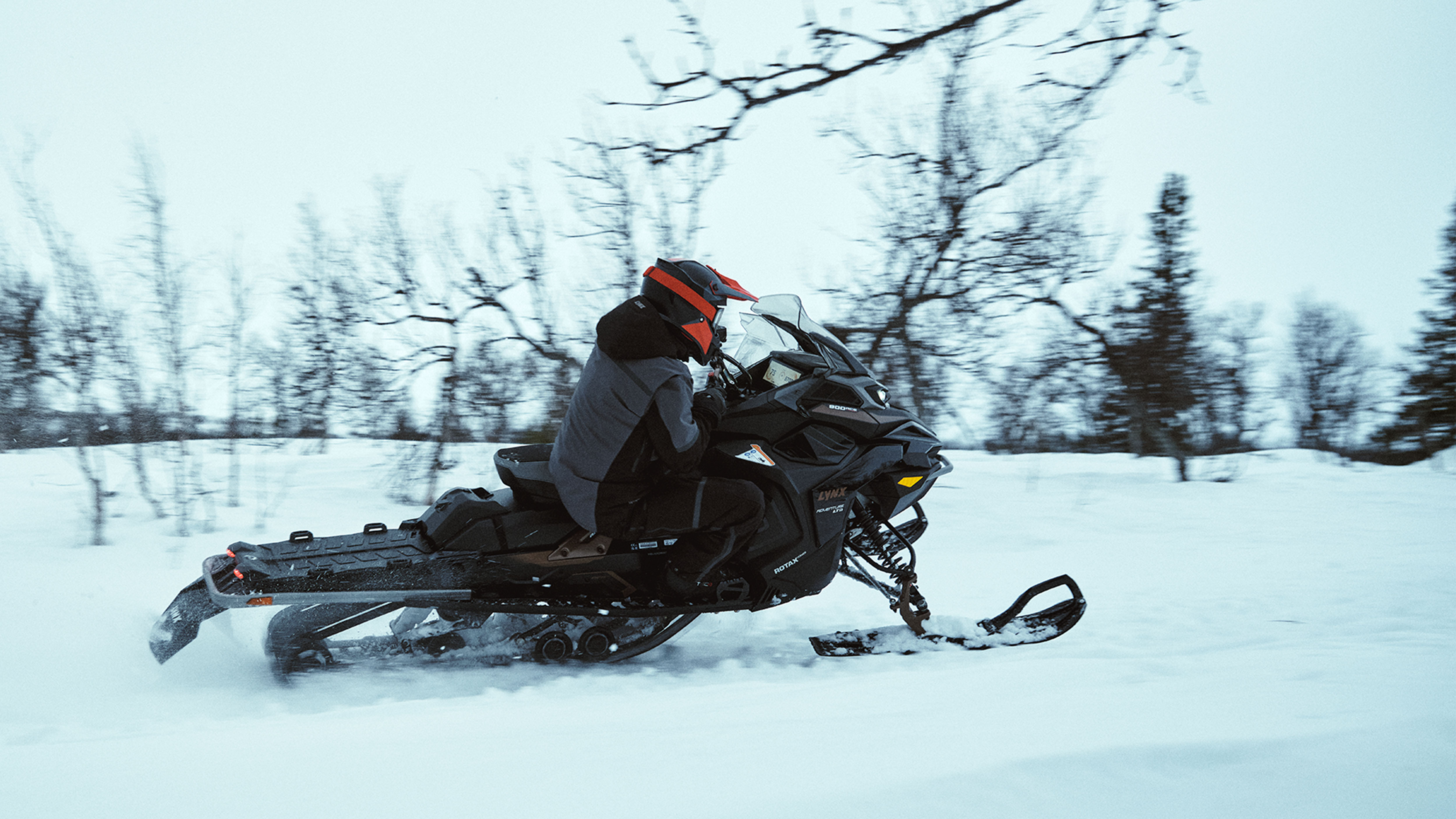 Lynx Adventure Limited 2025 snowmobile cornering fast on trail