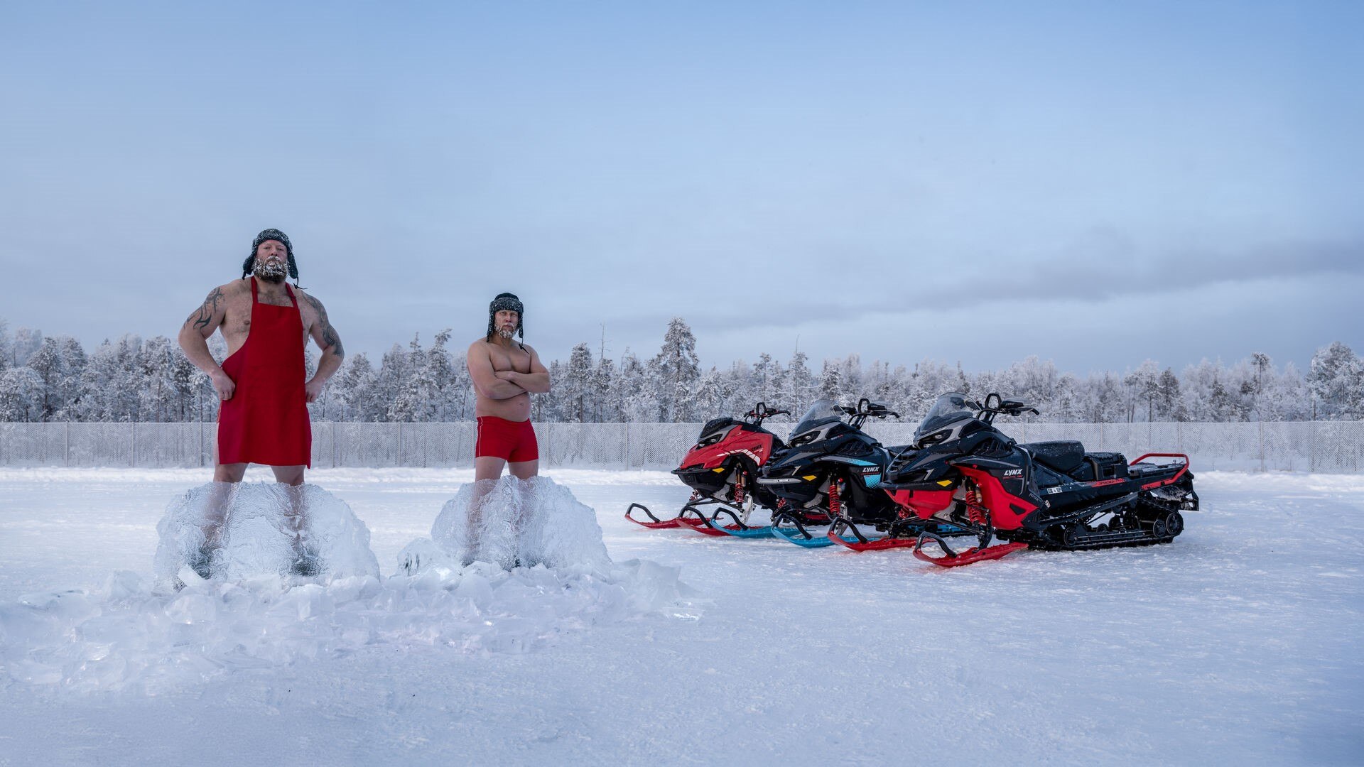 The new Lynx 2026 snowmobiles behind Joni and Timo